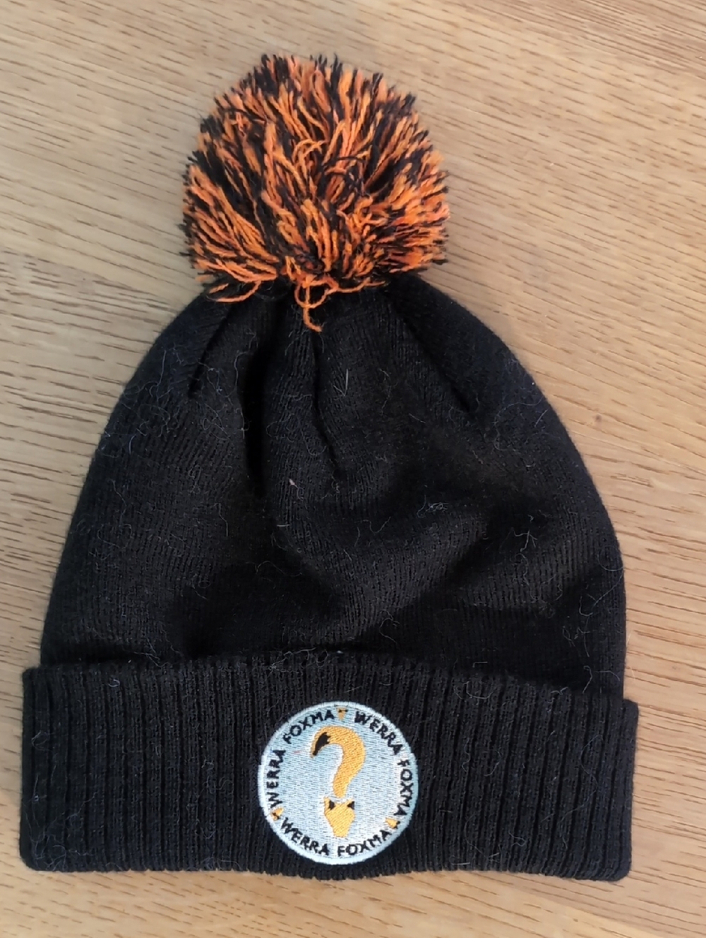 Werra Foxma Black Beanie with Orange-Black Pom Pom